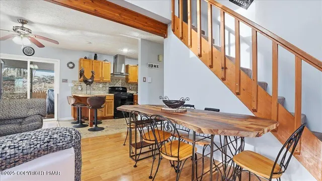 a kitchen with a refrigerator and a stove