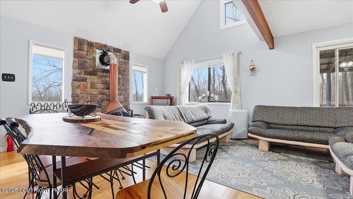 109 Saunders Drive Bushkill, PA 18324 - Photo 13 of 106 a view of a dining room with furniture window and wooden floor