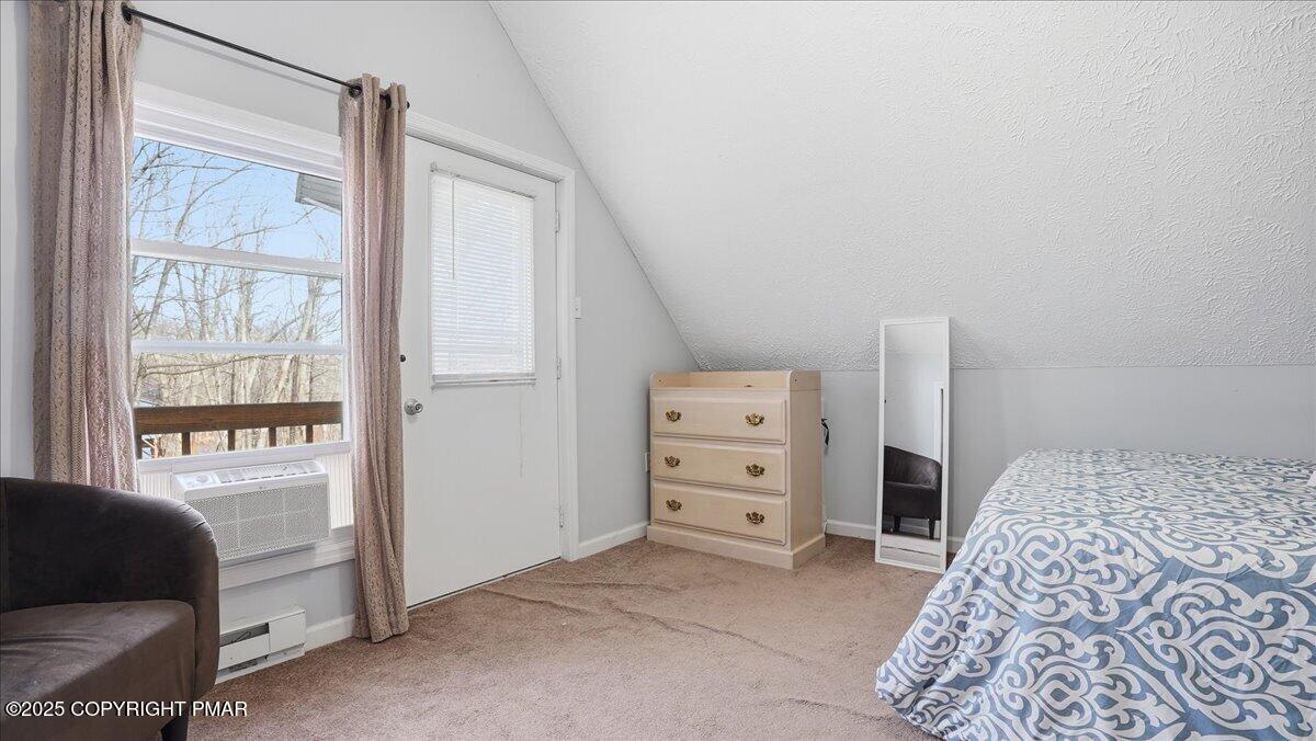 109 Saunders Drive Bushkill, PA 18324 - Photo 23 of 106 a bedroom with a bed and a window