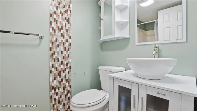 a view of a balcony with wooden floor and fence