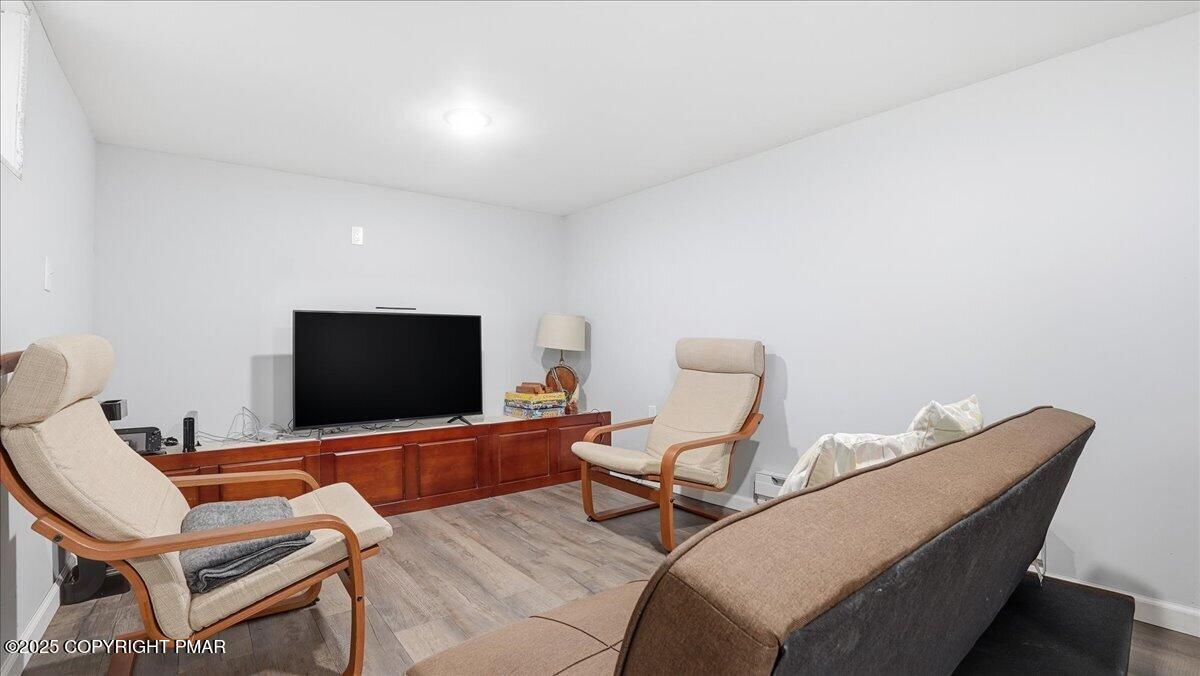 109 Saunders Drive Bushkill, PA 18324 - Photo 31 of 106 a living room with furniture and a flat screen tv