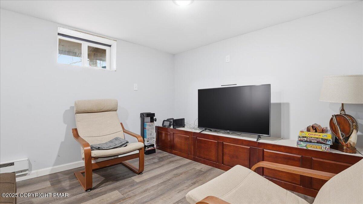 109 Saunders Drive Bushkill, PA 18324 - Photo 32 of 106 a living room with furniture and a flat screen tv