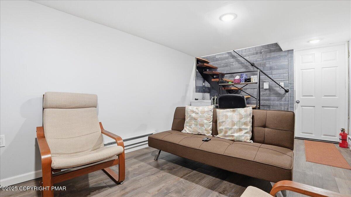 109 Saunders Drive Bushkill, PA 18324 - Photo 34 of 106 a living room with furniture and a wooden floor
