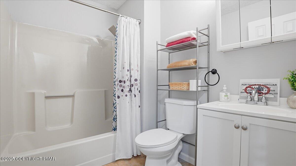 109 Saunders Drive Bushkill, PA 18324 - Photo 35 of 106 a bathroom with a sink toilet and shower
