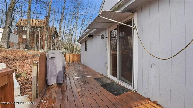 an aerial view of a house with pool table and chairs