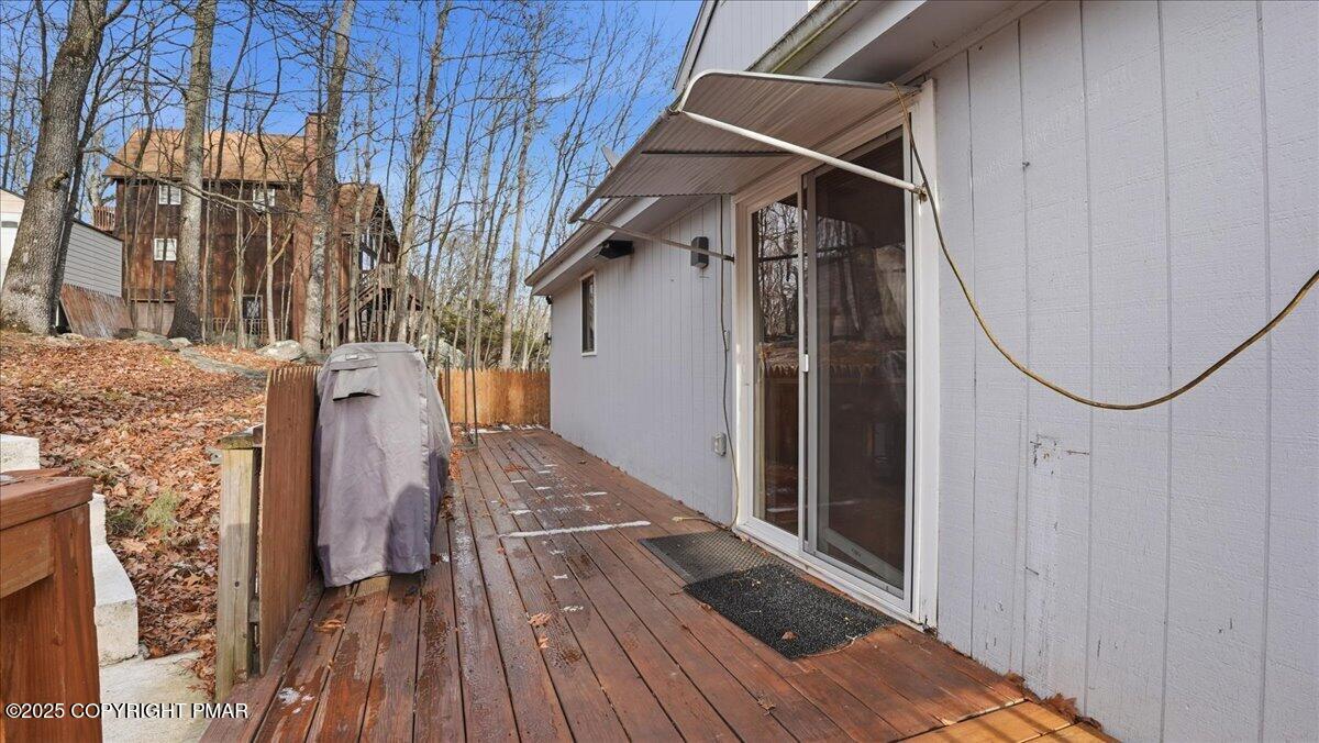 109 Saunders Drive Bushkill, PA 18324 - Photo 46 of 106 a view of a balcony with wooden floor and staircase