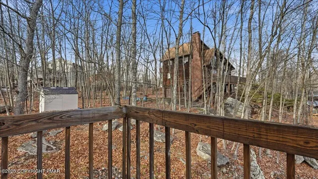 an aerial view of a house with table and chairs