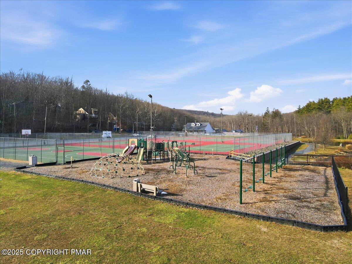 109 Saunders Drive Bushkill, PA 18324 - Photo 80 of 106 a view of a swimming pool with a lake