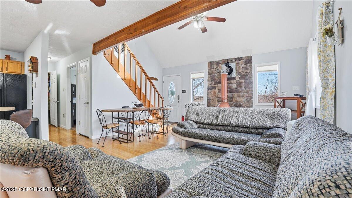 109 Saunders Drive Bushkill, PA 18324 - Photo 9 of 106 a living room with furniture wooden floor and a large window