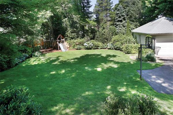 47 Nobscot Road Newton, MA 02459 - Photo 12 of 12 a view of a patio with table and chairs under an umbrella