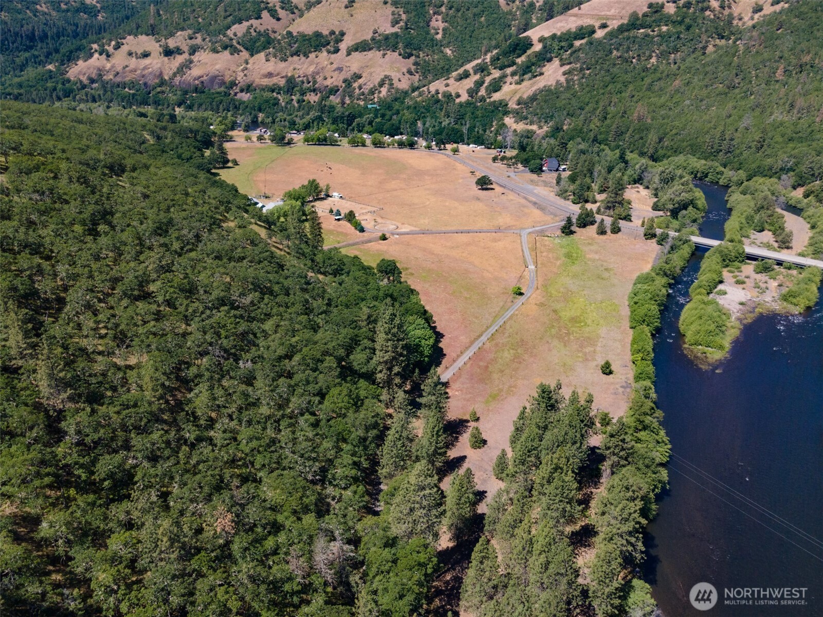 992 Highway 142 Lyle, WA 98635 - Photo 16 of 40 an aerial view of residential house with outdoor space and trees all around