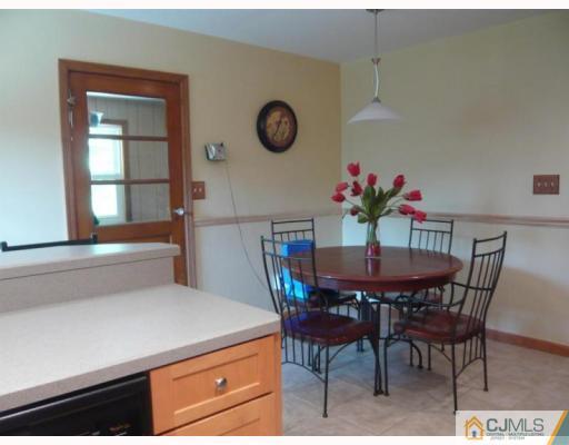 73 Kimberly Road Colonia, NJ 07067 - Photo 3 of 10 a dining room with furniture and window