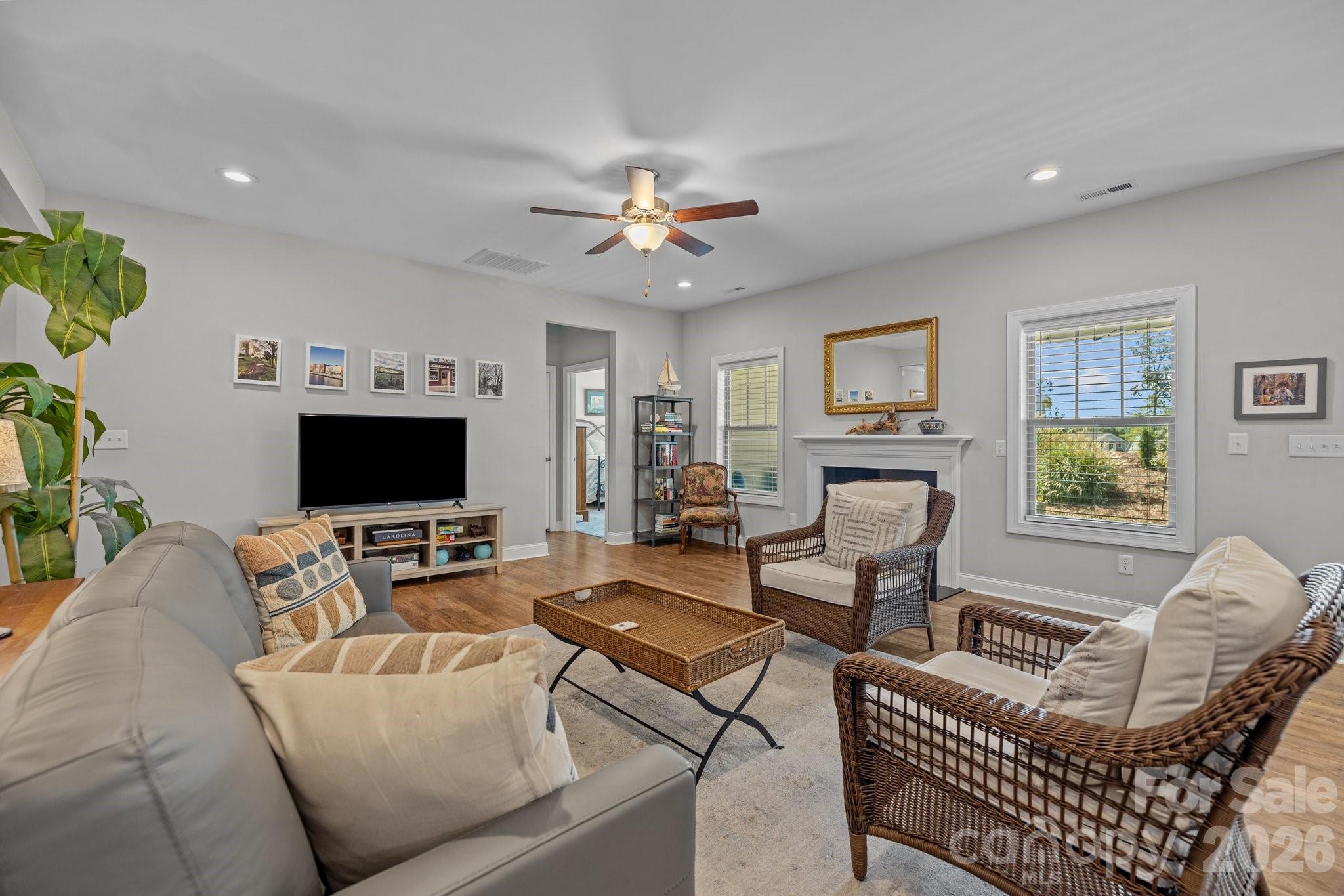 4697 Rinaldo Road York, SC 29745 - Photo 5 of 37 a living room with furniture a flat screen tv and a fireplace
