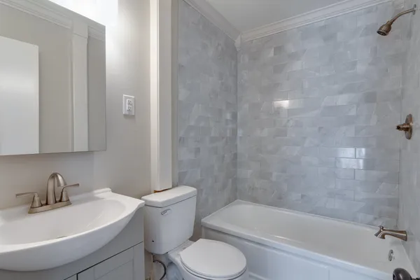 a bathroom with a sink toilet and bathtub