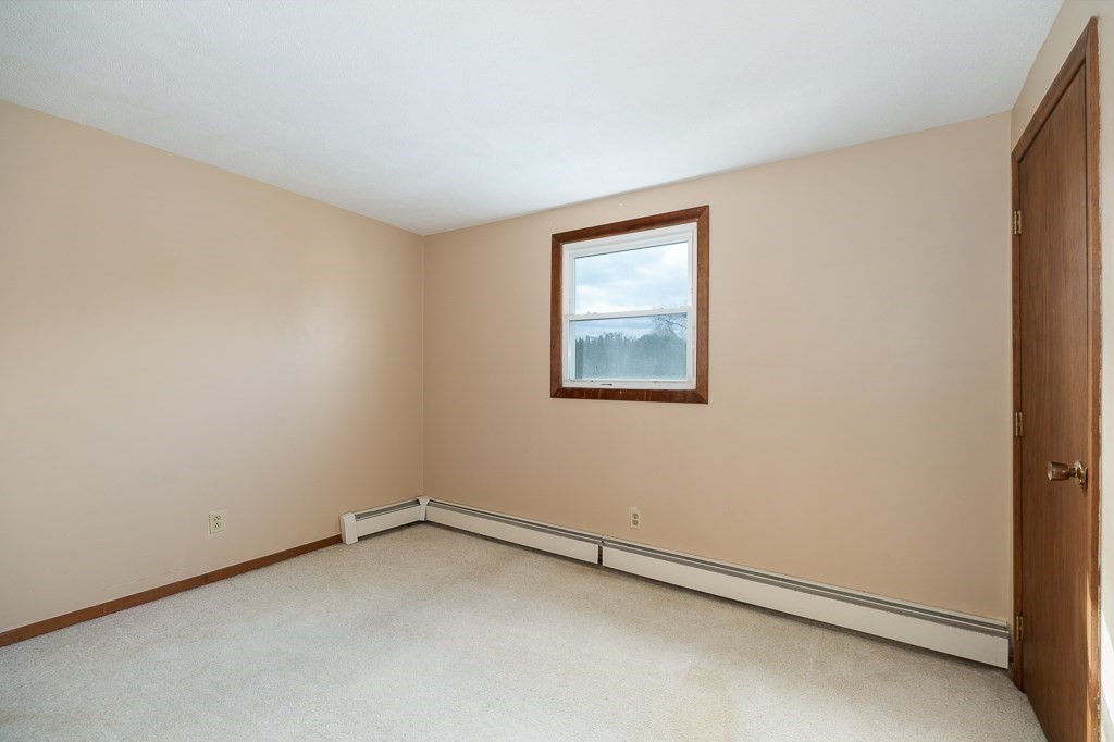 38 Matthies Street Beverly, MA 01915 - Photo 17 of 22 an empty room with a workbench