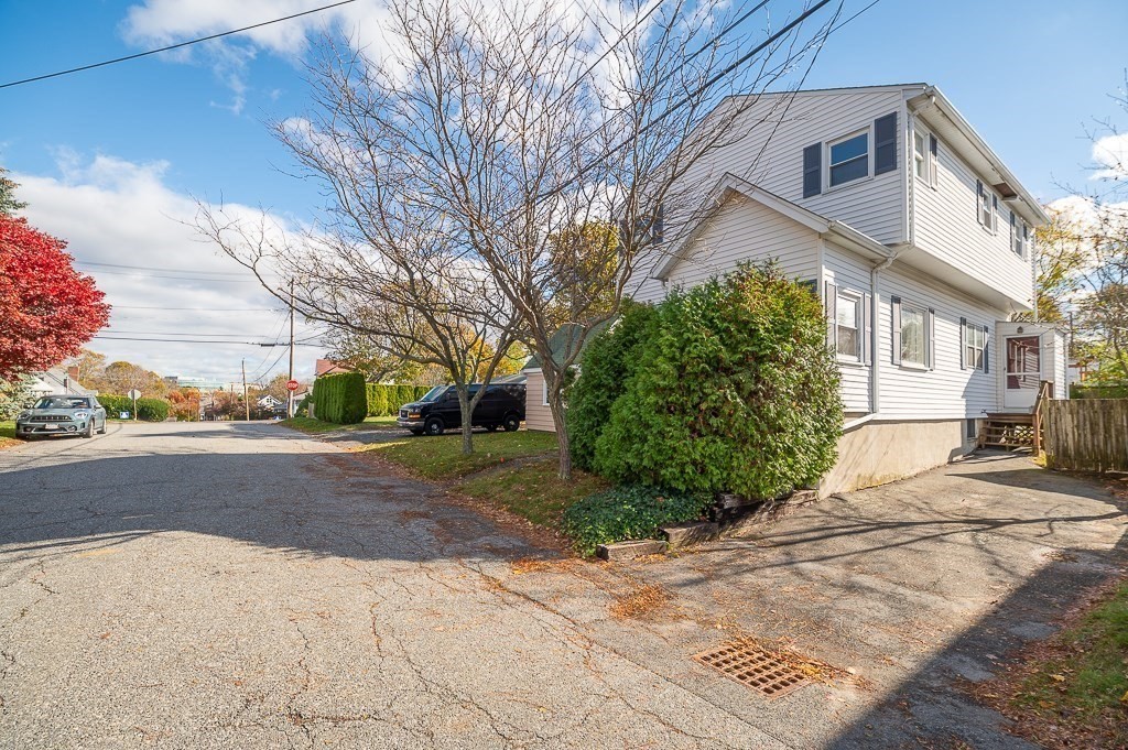 38 Matthies Street Beverly, MA 01915 - Photo 2 of 22 a view of a road with a house in the background