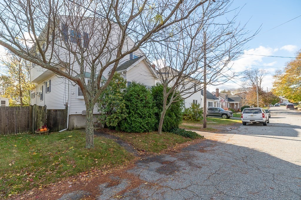 38 Matthies Street Beverly, MA 01915 - Photo 3 of 22 a view of a street with a cars park side of a road