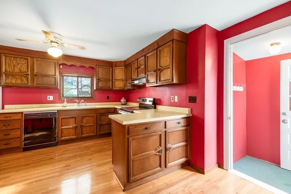 a kitchen with stainless steel appliances granite countertop a stove and a sink