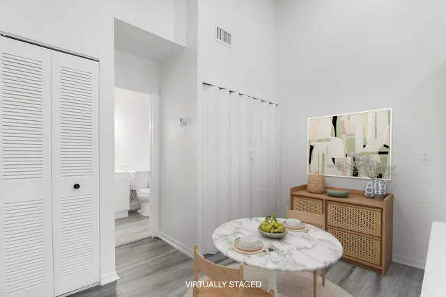 a view of a bathroom with a sink toilet and a mirror