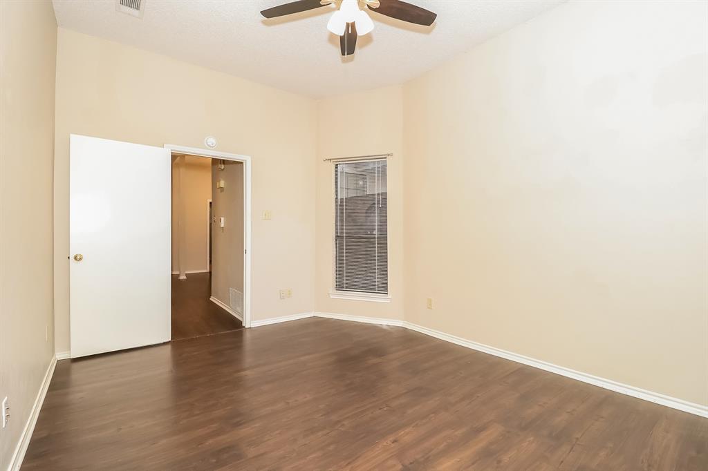 6308 Winton Street Dallas, TX 75214 - Photo 11 of 17 a view of an empty room with a ceiling fan