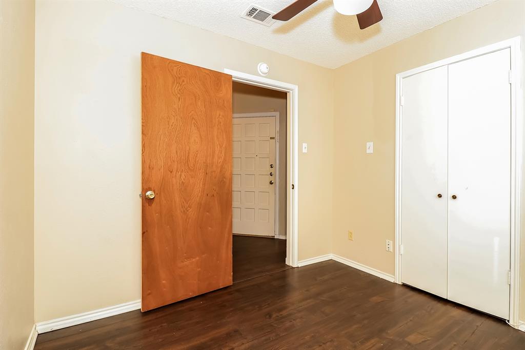6308 Winton Street Dallas, TX 75214 - Photo 10 of 17 a view of an empty room with wooden floor