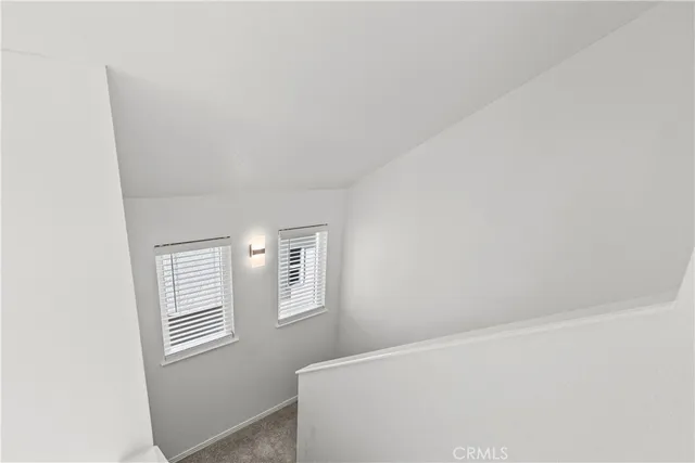 a view of empty room with windows