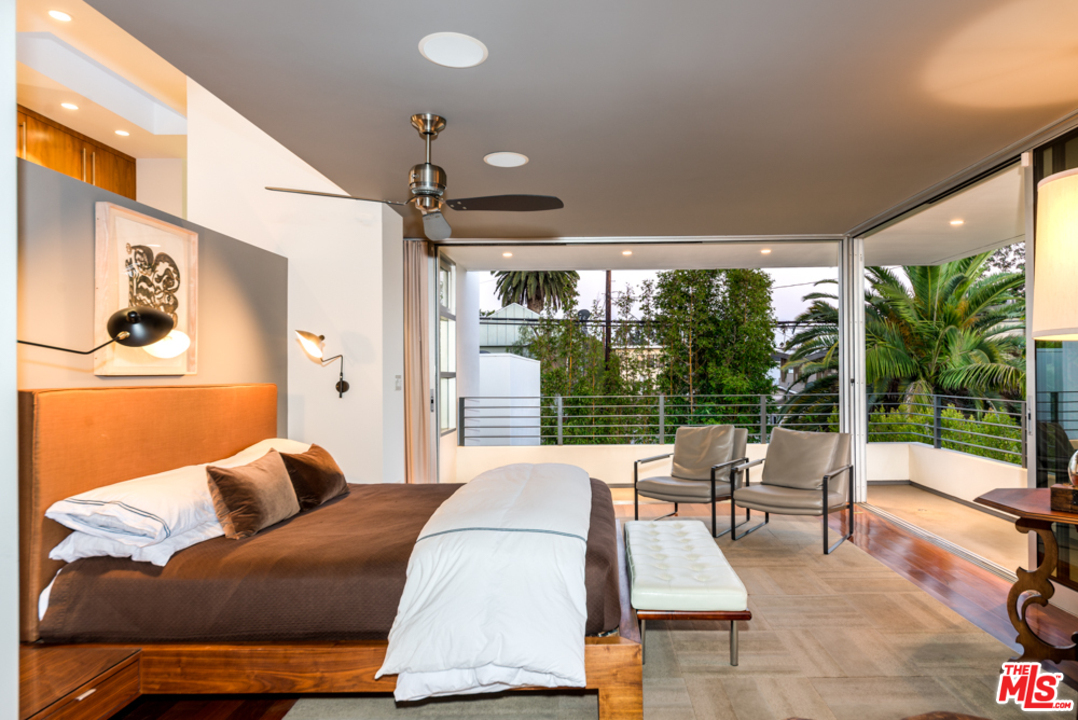 748 Palms Boulevard Venice, CA 90291 - Photo 12 of 17 a balcony with furniture and large windows