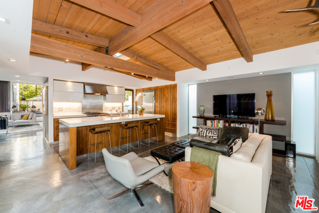 748 Palms Boulevard Venice, CA 90291 - Photo 9 of 17 a living room with furniture and a flat screen tv