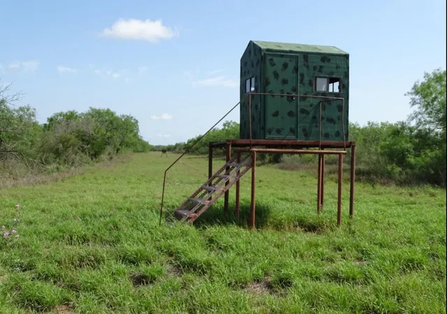 a view of a tall bench in a field