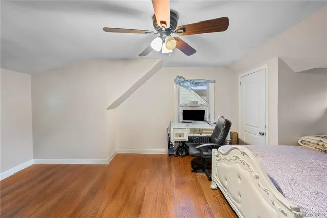 a bedroom with a bed and a table in it