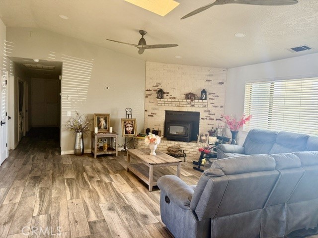 13375 Rincon Road Apple Valley, CA 92308 - Photo 9 of 72 a living room with furniture and a fireplace