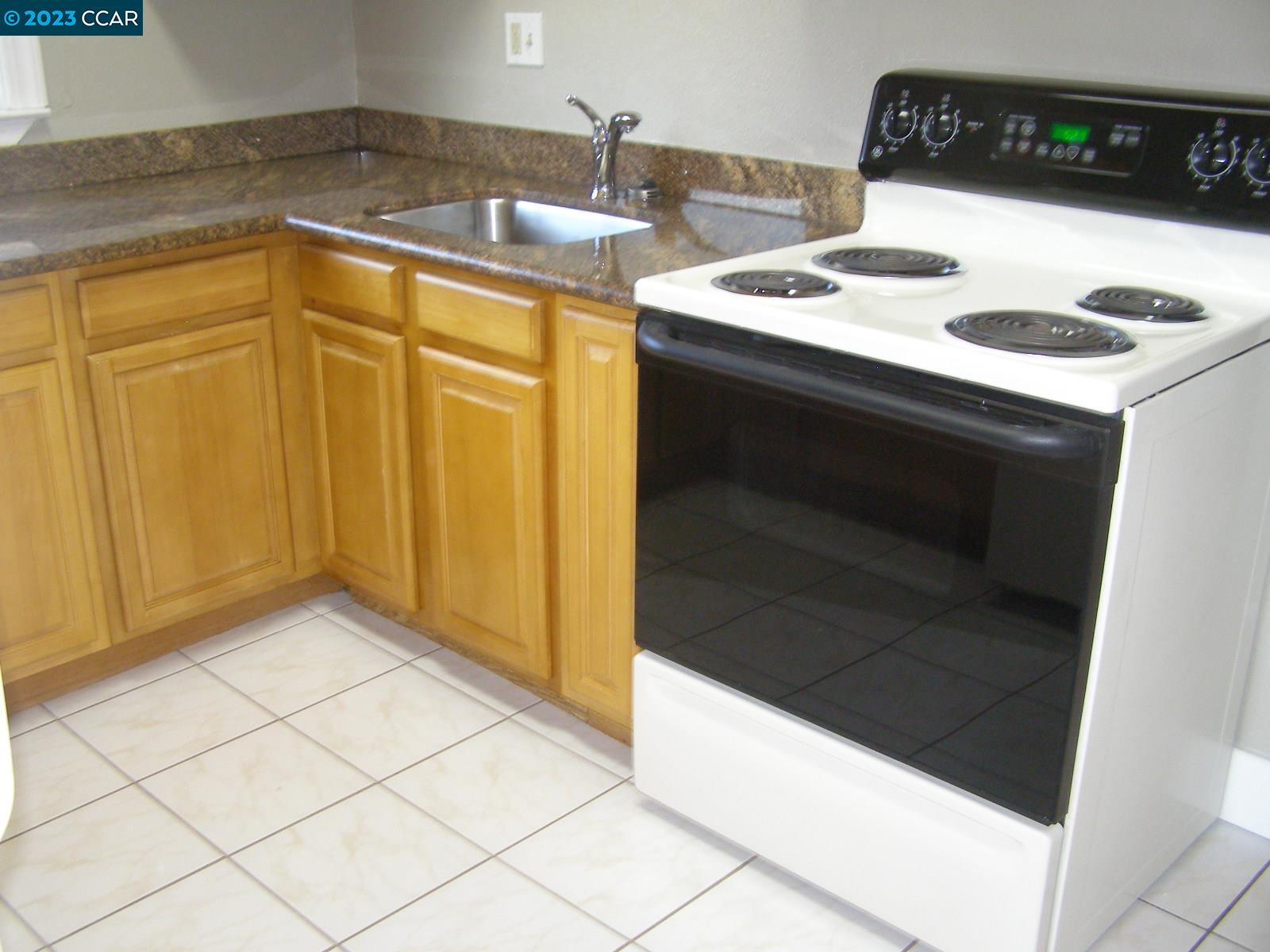 1128 16th Street Oakland, CA 94607 - Photo 15 of 26 a utility room with dryer and washer