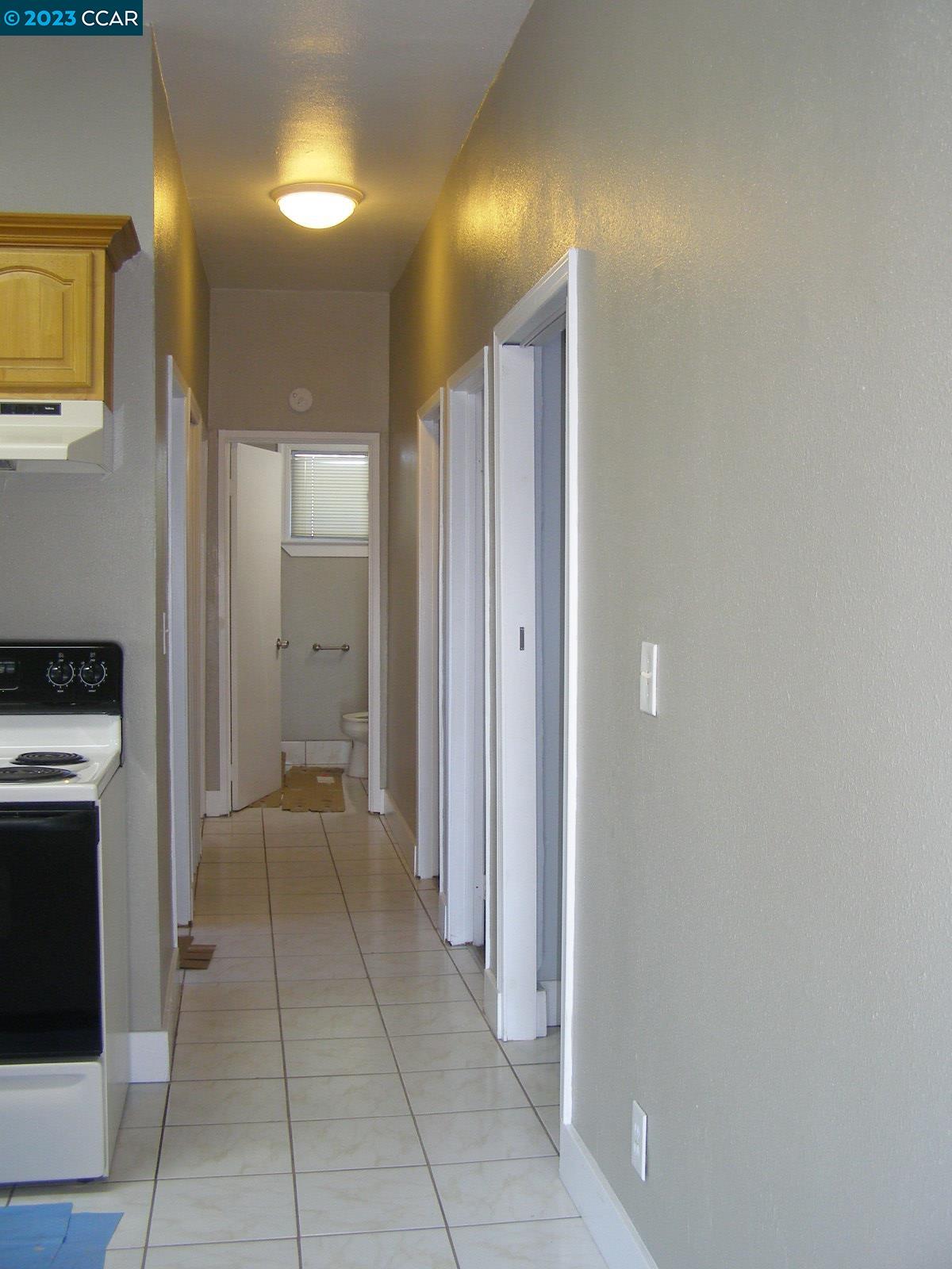 1128 16th Street Oakland, CA 94607 - Photo 16 of 26 a view of a hallway with washer and dryer