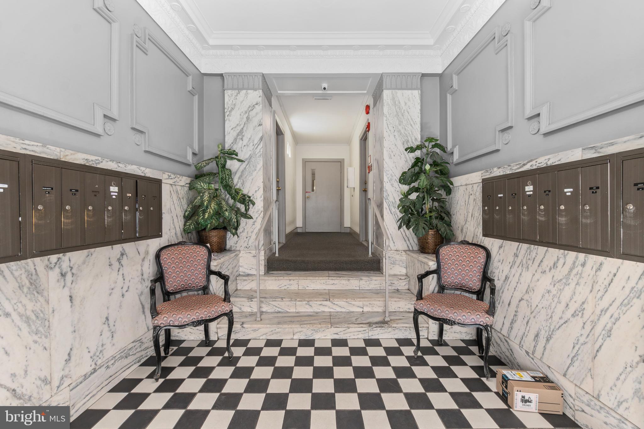 2145 California Street Northwest, Unit 102 Washington, DC 20008 - Photo 3 of 21 a living room with furniture and a potted plant