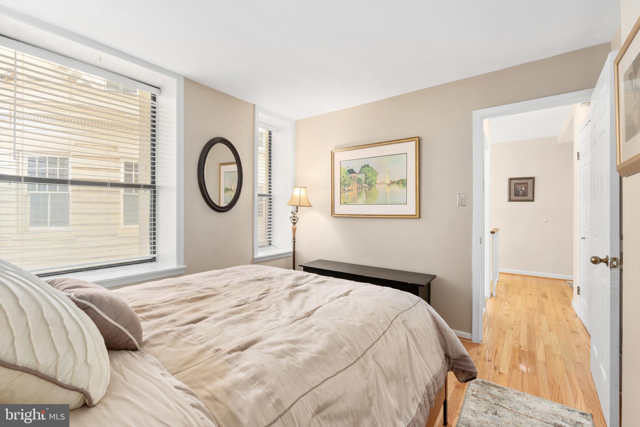 2145 California Street Northwest, Unit 102 Washington, DC 20008 - Photo 6 of 21 a bedroom with a bed and a window