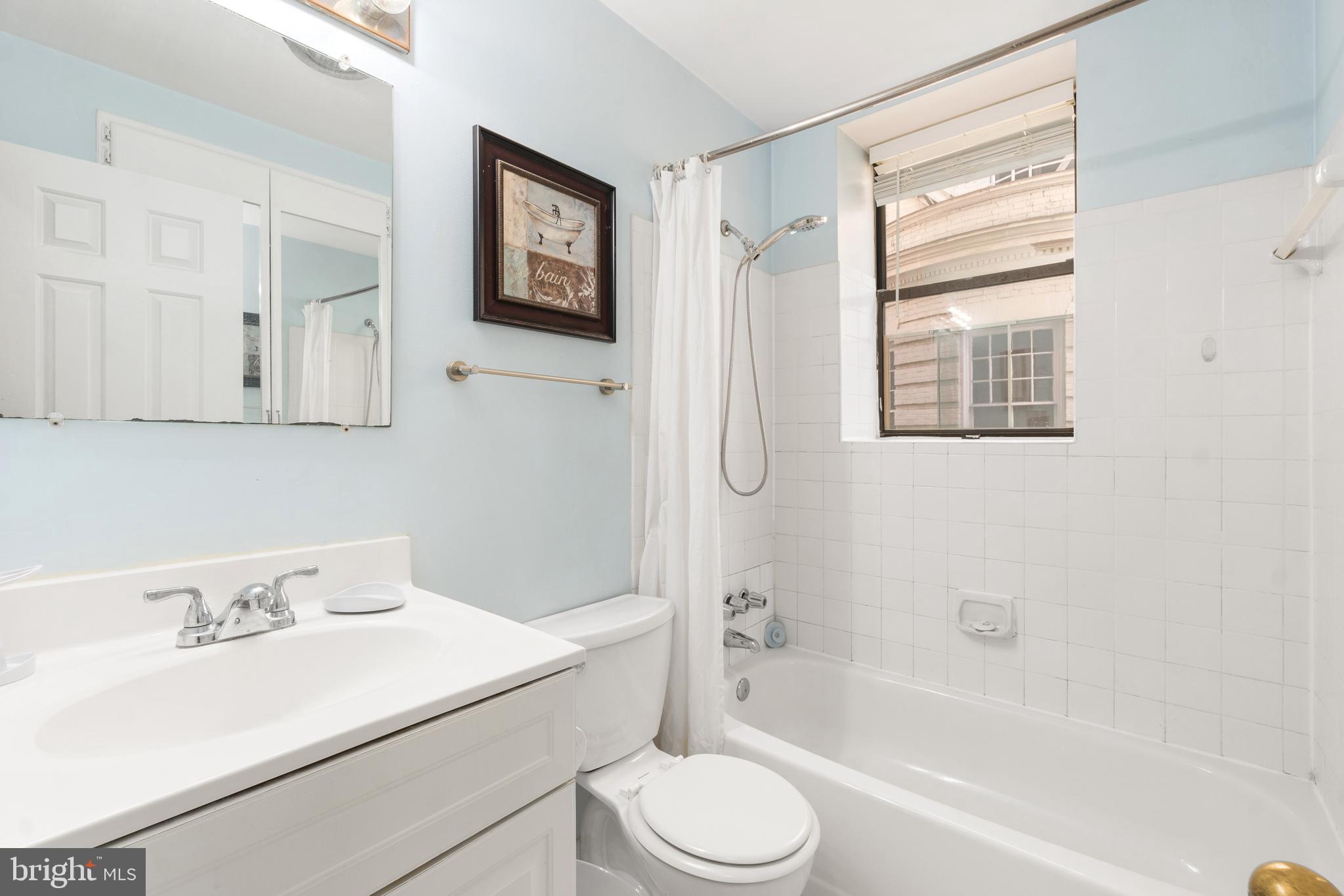 2145 California Street Northwest, Unit 102 Washington, DC 20008 - Photo 7 of 21 a bathroom with a sink toilet and shower
