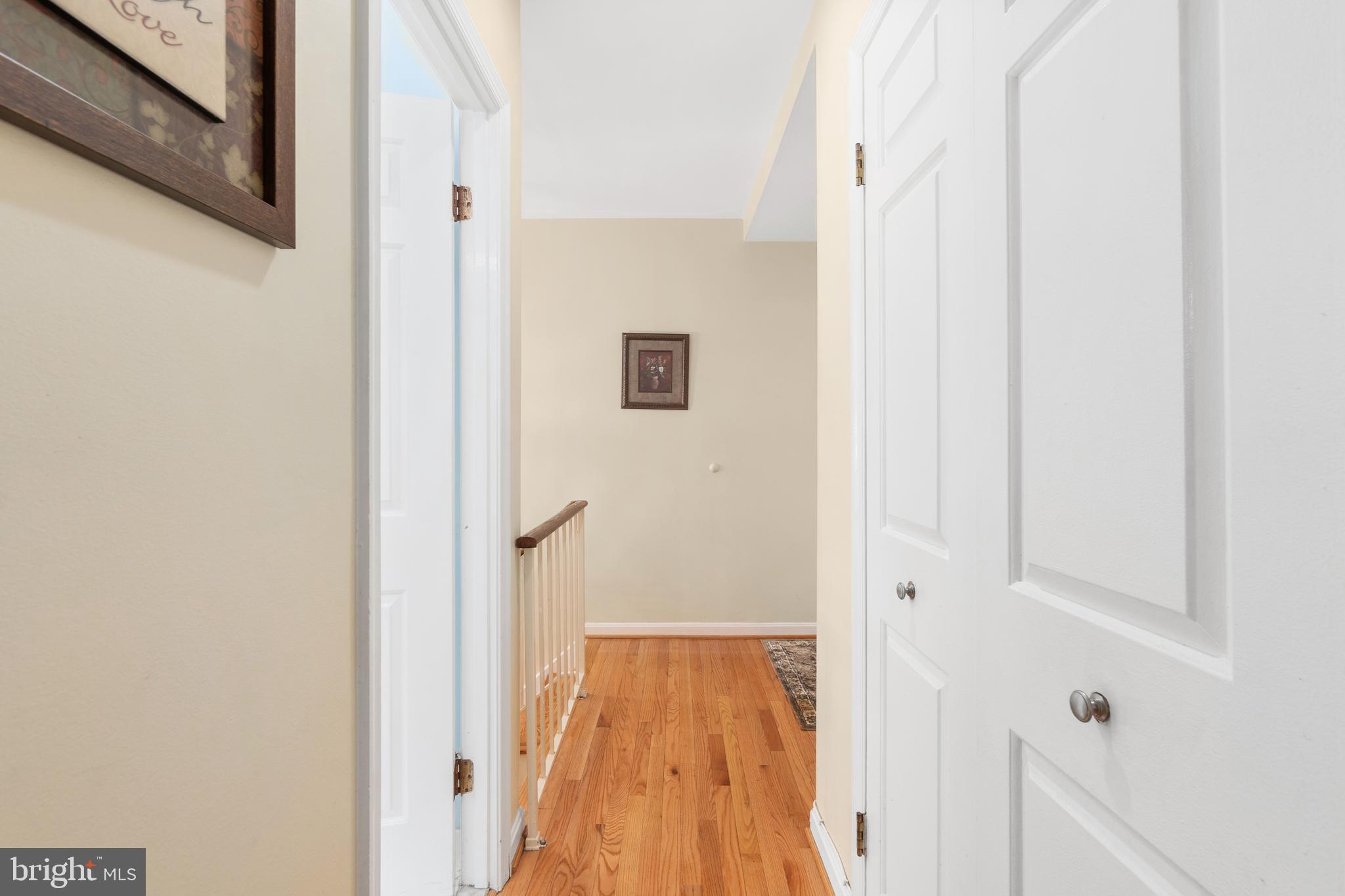 2145 California Street Northwest, Unit 102 Washington, DC 20008 - Photo 8 of 21 a view of a hallway with wooden floor and closet