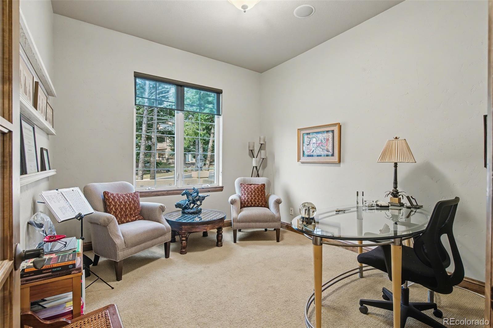 870 Mont Blanc View Colorado Springs, CO 80906 - Photo 14 of 42 a living room with furniture and a large window