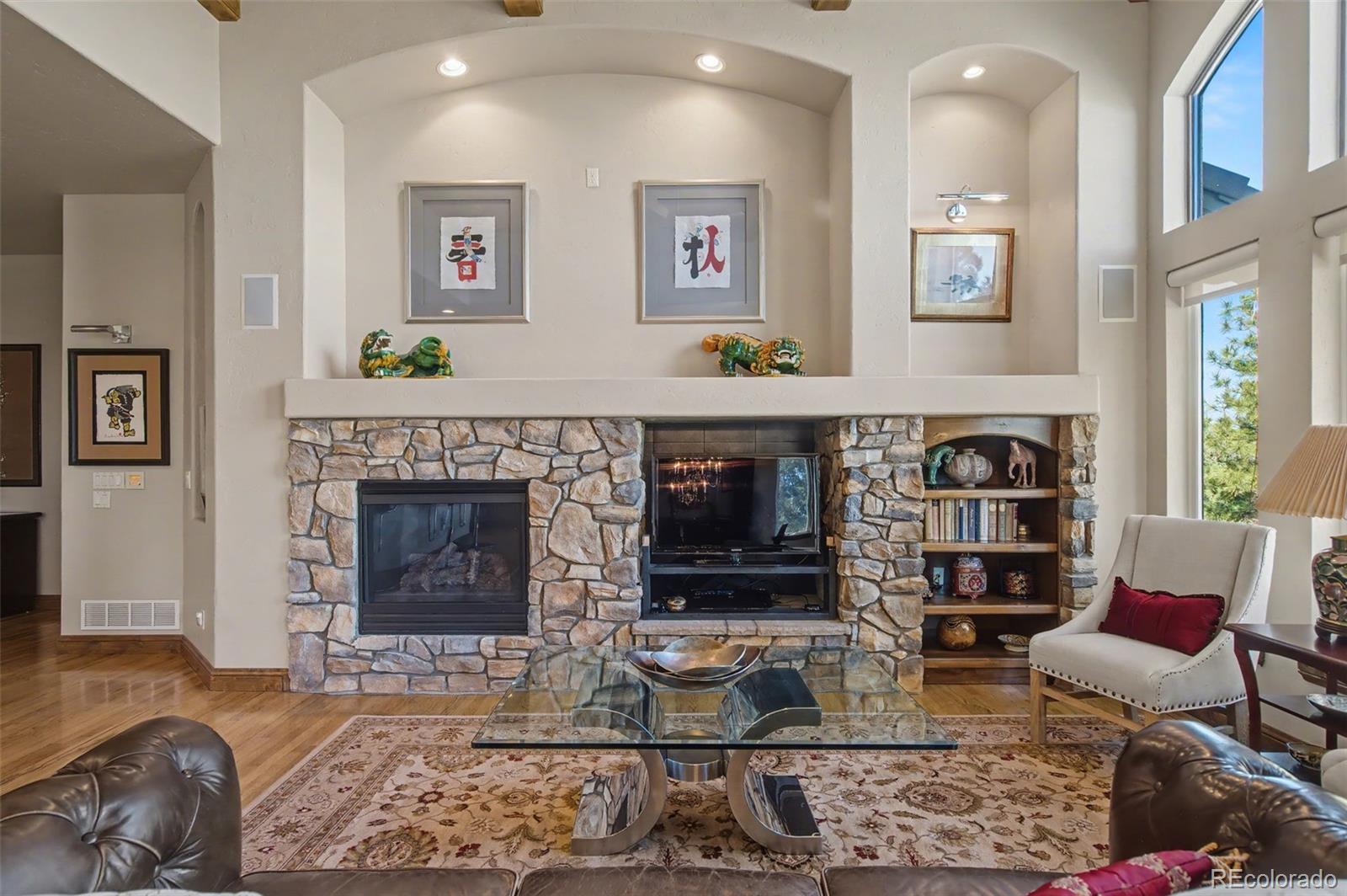 870 Mont Blanc View Colorado Springs, CO 80906 - Photo 8 of 42 a living room with furniture and a fireplace