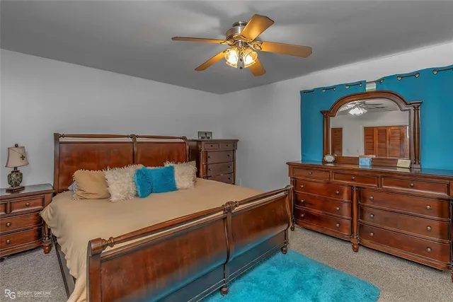 a bed room with a bed and a dresser