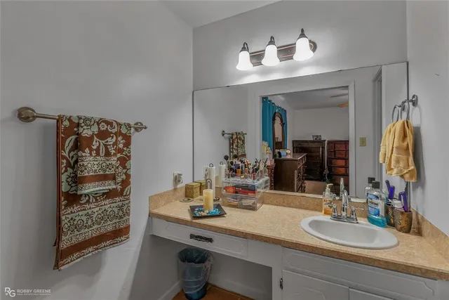 a bathroom with a sink double vanity and a mirror