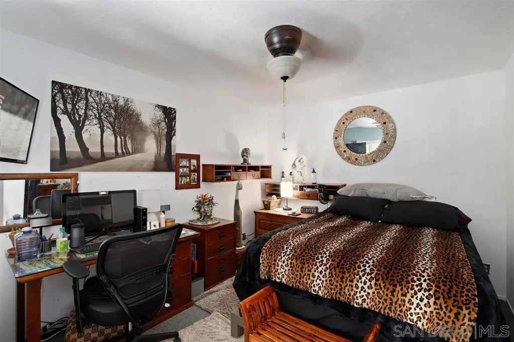 2465 Melru Lane Escondido, CA 92026 - Photo 13 of 25 a bed room with a bed and a chair