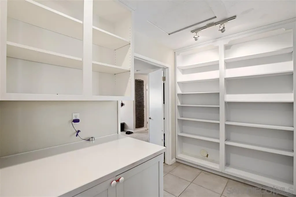 2465 Melru Lane Escondido, CA 92026 - Photo 14 of 25 a view of cabinets and washer in it
