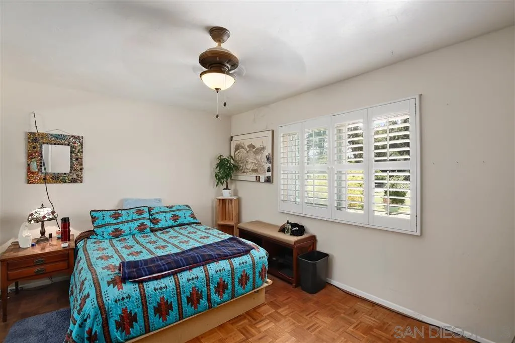 2465 Melru Lane Escondido, CA 92026 - Photo 16 of 25 a bedroom with a bed and a window