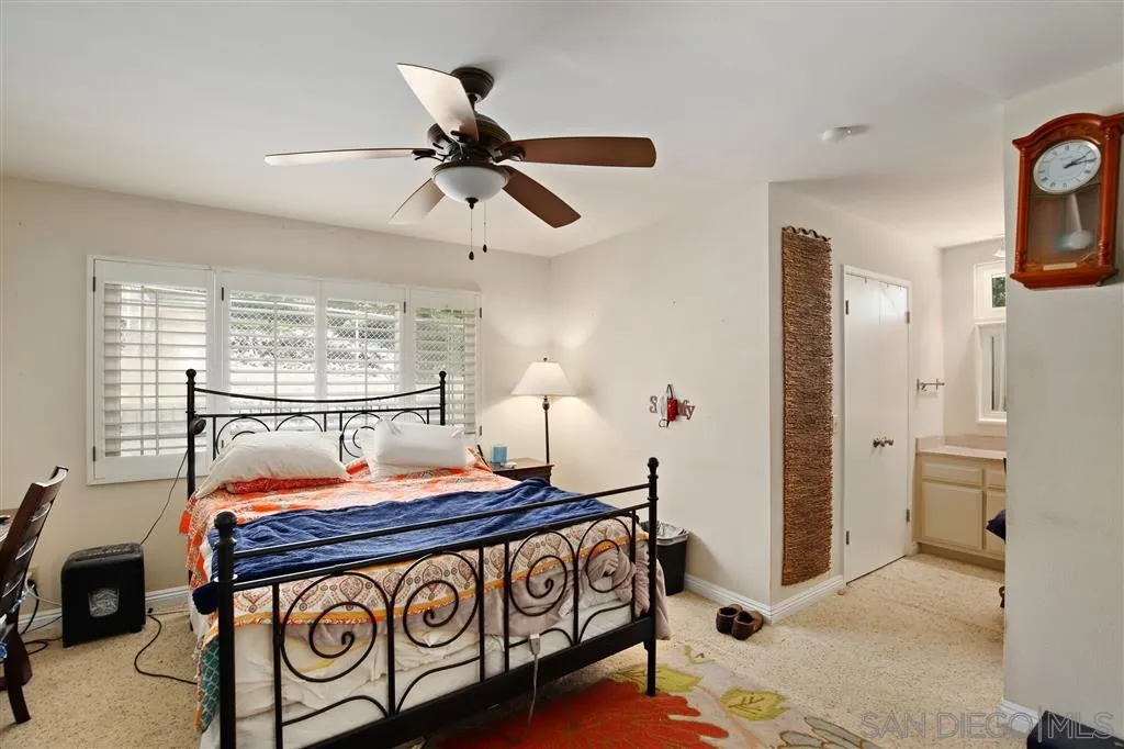 2465 Melru Lane Escondido, CA 92026 - Photo 17 of 25 a bedroom with a bed and wooden floor