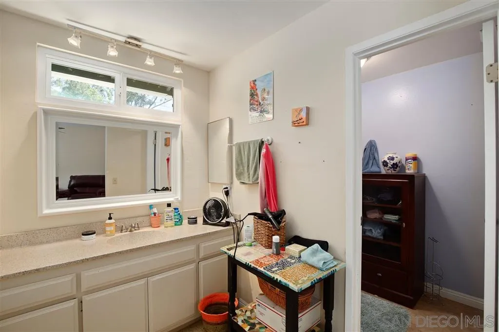2465 Melru Lane Escondido, CA 92026 - Photo 18 of 25 a bathroom with a sink and a mirror