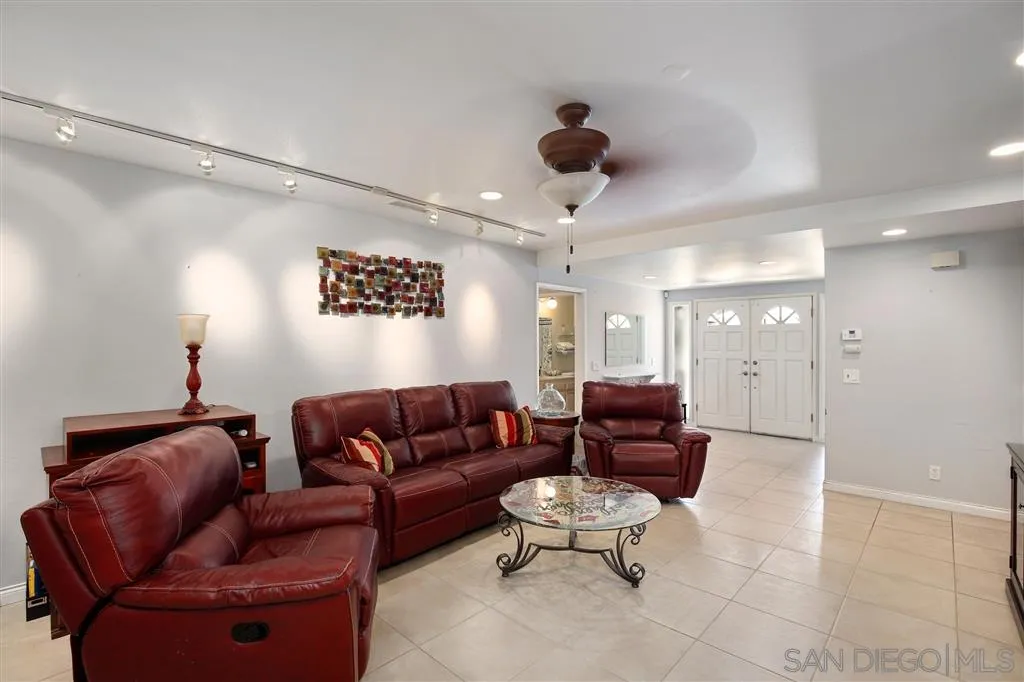 2465 Melru Lane Escondido, CA 92026 - Photo 4 of 25 a living room with furniture and a glass door shower
