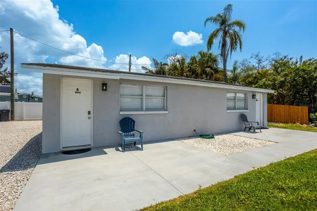 a house view with a backyard space