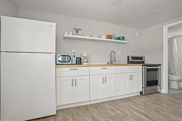 a living room with furniture a window and a table