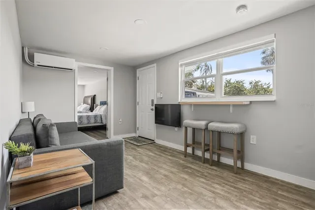 a kitchen with white cabinets and appliances